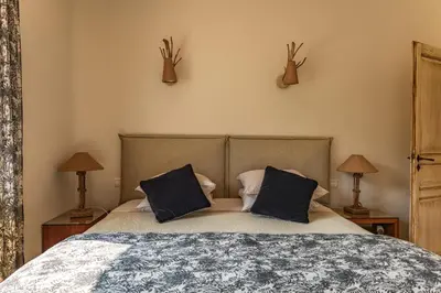 a bedroom with a bed with two pillows on it at Villa Elsa Di Palombaggia in Porto-Vecchio