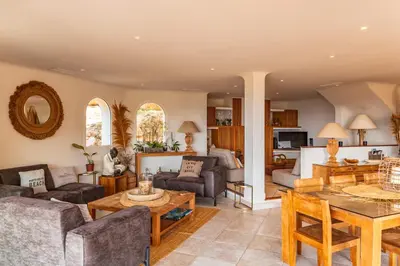 a living room with a couch and a table at Villa Elsa Di Palombaggia in Porto-Vecchio
