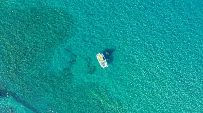 an aerial view of a boat in the water at Camping Merendella in San-Nicolao