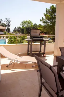 a laptop computer sitting on a table on a balcony at Apartment A Suara Linda-2 by Interhome in Ghisonaccia