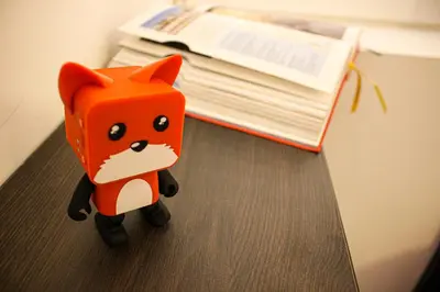 a toy of a fox sitting on a desk at Rosie's Club in Ajaccio