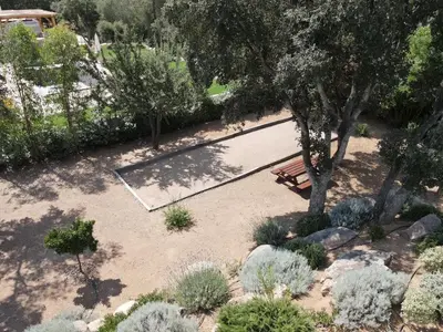 an overhead view of a park with a bench and trees at VILLA ISULA by Intendance Excellency in Sainte-Lucie de Porto-Vecchio