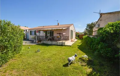 a sheep standing in the yard of a house at Amazing Home In Borgo With Kitchen in Borgo