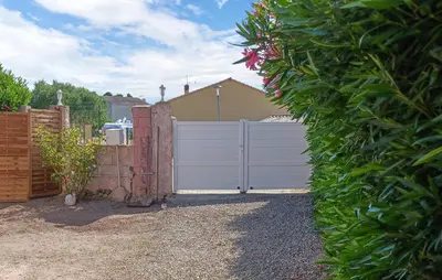a white fence with a gate in a yard at Amazing Home In Borgo With Kitchen in Borgo