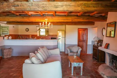 a living room with a couch and a table at Casa Sarralonga Di Porto-Vecchio in Porto-Vecchio