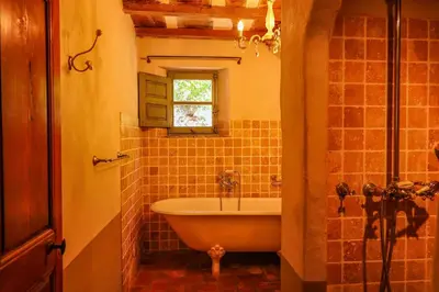a bathroom with a tub and a window at Casa Sarralonga Di Porto-Vecchio in Porto-Vecchio