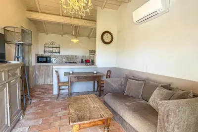 a living room with a couch and a table at Casa Palombaggia Di Porto-Vecchio in Porto-Vecchio