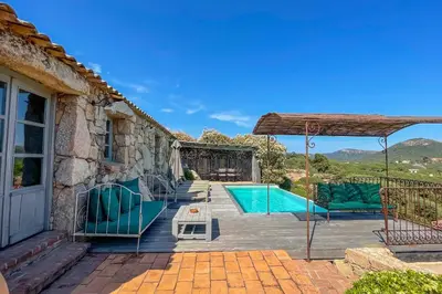 a patio with a swimming pool and a house at Casa Percale Di Porto-Vecchio in Porto-Vecchio