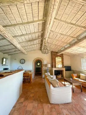 a living room with a couch and a table at Casa Percale Di Porto-Vecchio in Porto-Vecchio