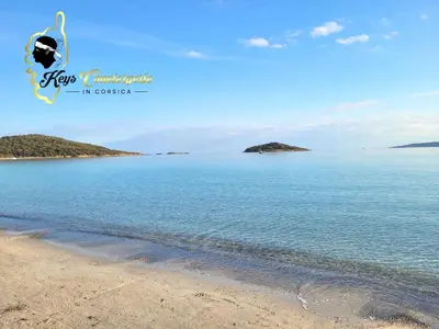 a view of the beach from the shore at Maison de Plage à pied San Cipriano 5 pers in Lecci