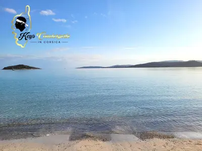 a picture of the beach and the ocean at Maison de Plage à pied San Cipriano 5 pers in Lecci