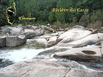 a river with rocks in the middle of it at Maison de Plage à pied San Cipriano 5 pers in Lecci