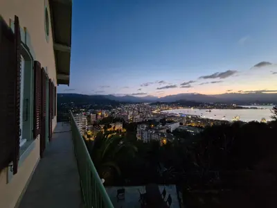 a view of a city from the balcony of a building at VILLA BELVEDERE D'AJACCIO, VILLA ENTIERE VUE MER POUR 2 à 10 VOYAGEURS in Ajaccio