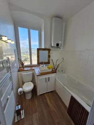 a bathroom with a toilet and a sink and a tub at VILLA BELVEDERE D'AJACCIO, VILLA ENTIERE VUE MER POUR 2 à 10 VOYAGEURS in Ajaccio