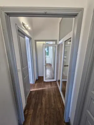 an empty hallway with a door and a mirror at VILLA BELVEDERE D'AJACCIO, VILLA ENTIERE VUE MER POUR 2 à 10 VOYAGEURS in Ajaccio