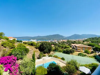 a view of a tennis court with a tennis racket at A Funtana deux chambres, vue mer, piscine et tennis in Propriano