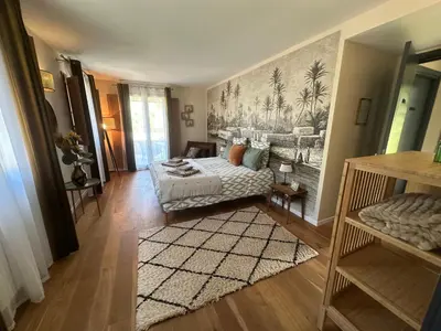 a bedroom with a bed with a painting on the wall at CASA VOLTEGIRA in Manso
