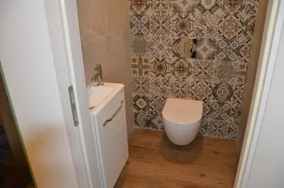 a bathroom with a toilet and a sink at casa funtana d u frusteru in Propriano