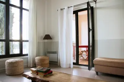 a living room with a couch and a table at Les Salins in Porto-Vecchio