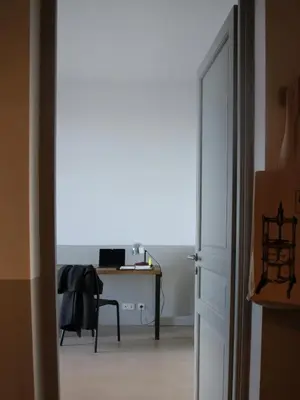 a room with a desk and a table with a chair at Les Salins in Porto-Vecchio
