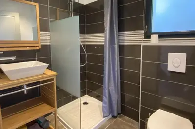 a bathroom with a sink and a shower at L'Ortu Di Pisettu -2 in Conca