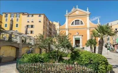 a church in a city with trees and buildings at Toit Terrasse centre historique in Ajaccio
