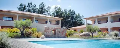 a house with a swimming pool in front of a house at Appart RDC ALZETU CLIMATISE - 2 MIN PLAGE - PISCINE in Lecci