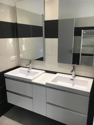 a bathroom with two sinks and a large mirror at Villa Tinuta 8 pers piscine chauffée 5 min plage en voiture in Sainte-Lucie de Porto-Vecchio