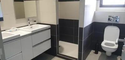 a bathroom with a toilet and a sink at Villa Tinuta 8 pers piscine chauffée 5 min plage en voiture in Sainte-Lucie de Porto-Vecchio