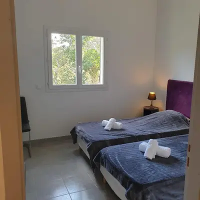 a bathroom with a sink and a mirror at Villa Salute 6 pers 5 min plage en voiture in Porto-Vecchio