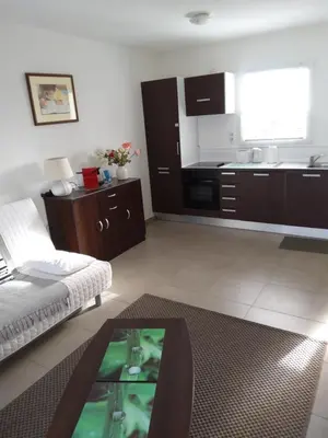a living room with a couch and a coffee table at Lecci St Cyprien Don Andria in Porto-Vecchio