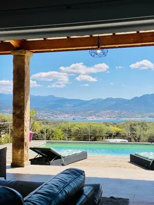 a view of a swimming pool from a house at Villa vue mer 4 chambres in Olmeto