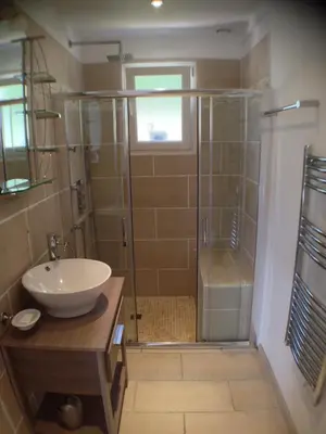 a bathroom with a shower and a sink and a showerspective at Villa piscine Sagone Paradise avec magnifique vue mer in Sagone