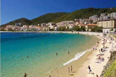 a group of people on a beach in the water at Suite Letizia in Ajaccio