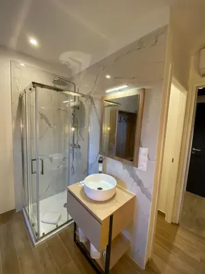 a bathroom with a sink and a shower at Hotel U Catagnu in San-Nicolao