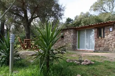 a stone house with a table in front of it at Chalet Conca in Conca