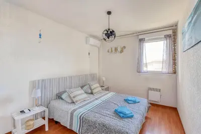 a bedroom with a bed with blue towels on it at Cappella in Ajaccio
