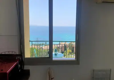 a large window with a view of the ocean at Santa Lina in Ajaccio