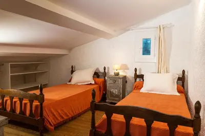 a bedroom with two beds and a window at Résidence Marie Diane - Laurier des Mers in Propriano