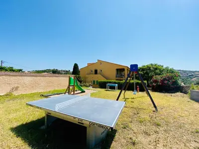 a ping pong table with a ladder and a camera at Résidence Marie Diane - Laurier des Mers in Propriano
