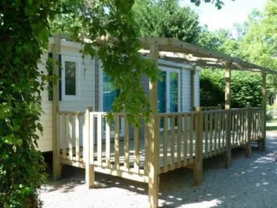 a house with a porch and a gazebo at CAMPING U SOMMALU in Casaglione