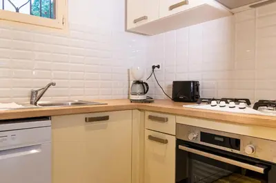 a kitchen with a sink and a counter top at Résidence Marie Diane - Grand Duplex H in Propriano