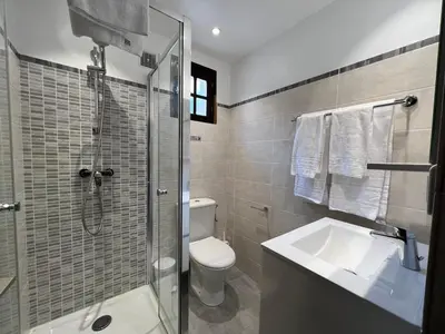 a bathroom with a toilet and a sink and a shower at Résidence Marie Diane - Appart vue mer et piscine G in Propriano