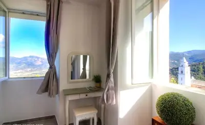 a bathroom with a mirror and a window at Gite Casa di Emma in Santo-Pietro-di-Tenda