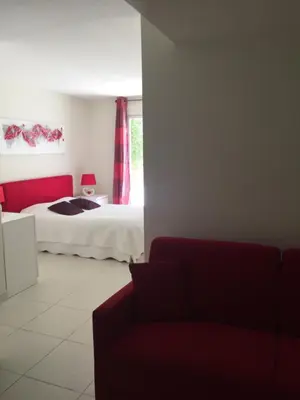a living room with a bed and a couch at Le Loft in Ajaccio