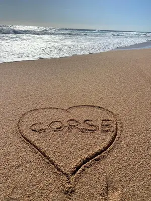 a heart drawn in the sand on the beach at Le Loft in Ajaccio