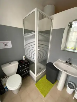 a bathroom with a shower and a toilet and a sink at Charmant T1 plein centre Corte au 13 cours paoli wifi gratuit calme lumineux in Corte