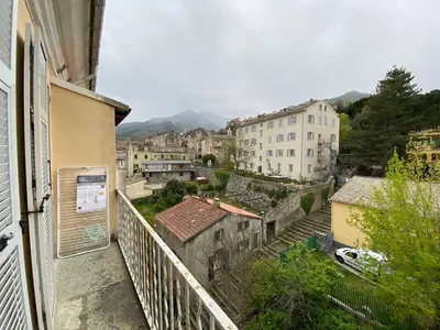 a view of a city from a balcony at Charmant T1 plein centre Corte au 13 cours paoli wifi gratuit calme lumineux in Corte