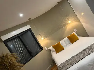 a bedroom with a bed and a window at Appartements de Standing - Panate in Corte