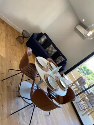 a pair of shoes sitting on chairs in a room at Appartements de Standing - Panate in Corte
